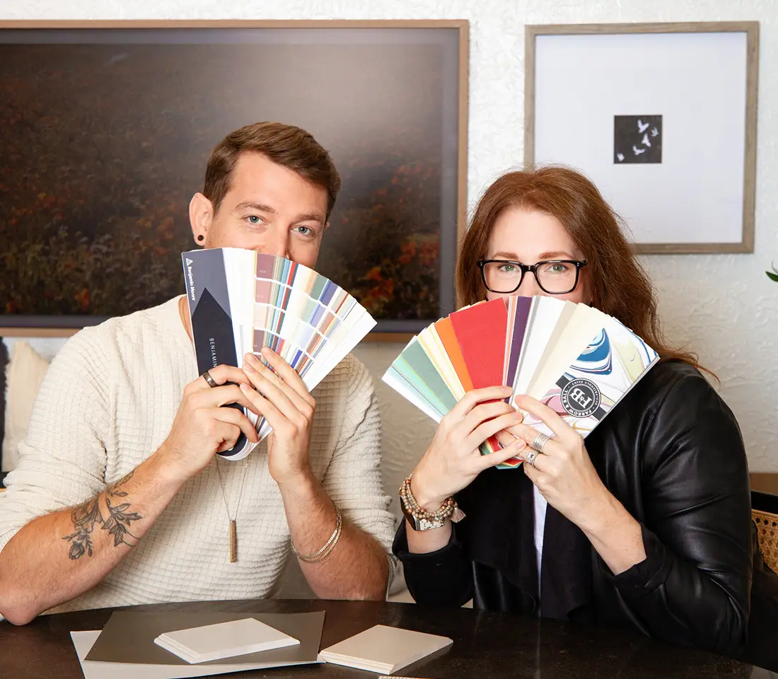 Kate and Parker holding up swatch cards